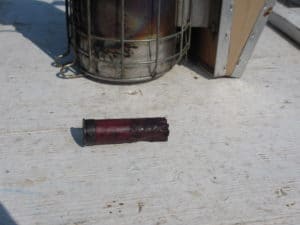 The spent shotgun shell used as a smoker plug.